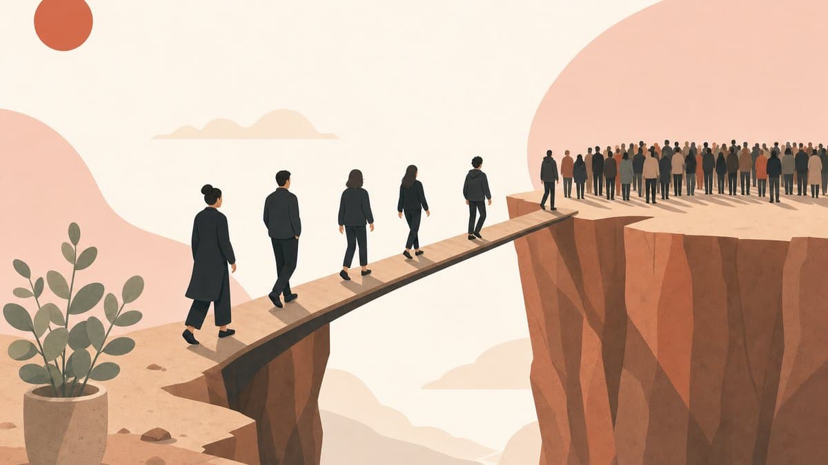 An illustrated deep canyon with a narrow bridge connecting a small group of early users to a large crowd waiting on the far cliff
